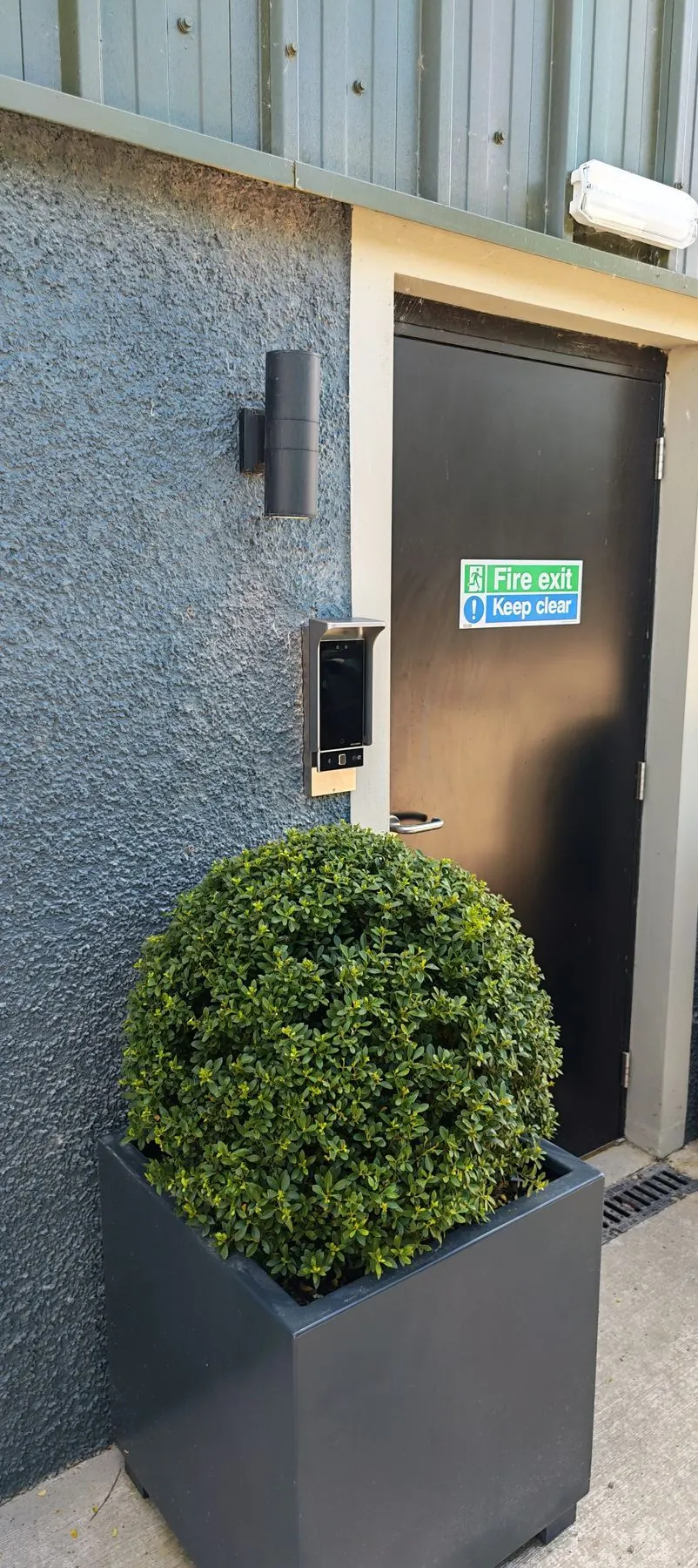 Centum commercial Hikvision face recognition access control terminal at a staff entrance