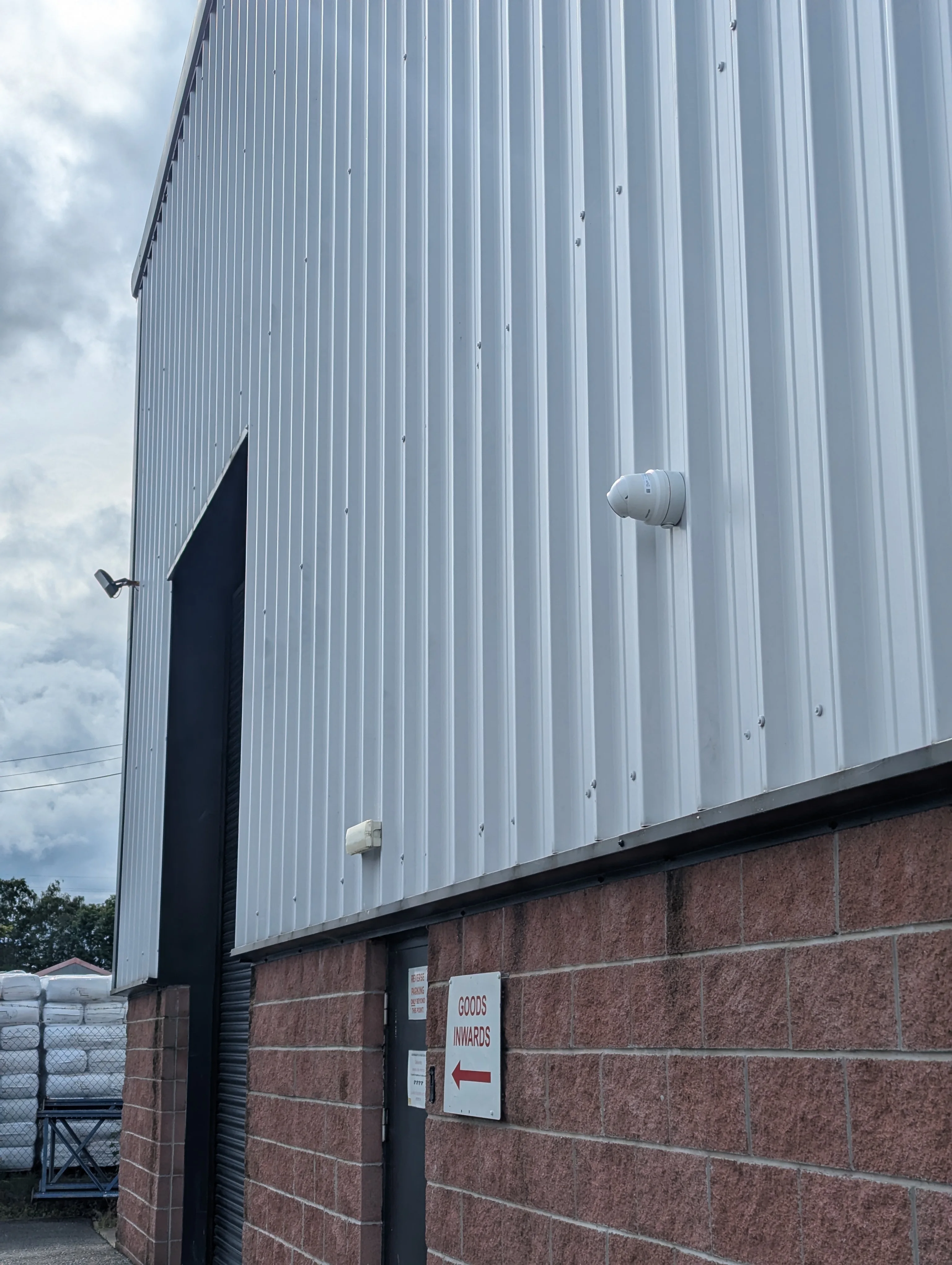 Hikvision CCTV camera fitted to an industrial commercial building for perimeter coverage.