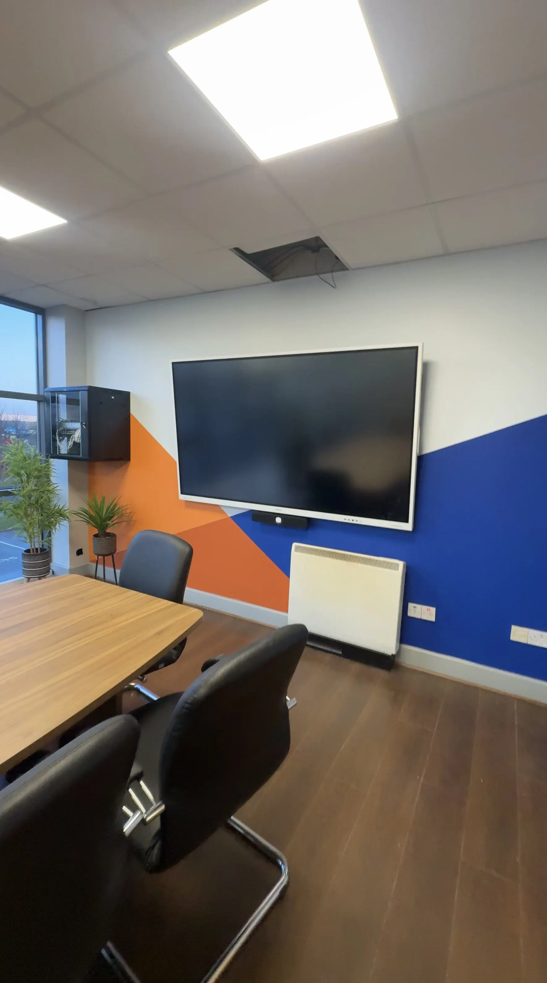 Commercial meeting room screen and AV system installation for a Belfast business.