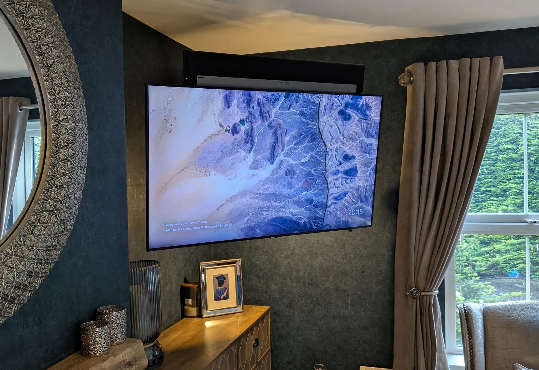 Living room wall mounted TV installation with Audio/Visual setup by True Tech Solutions.
