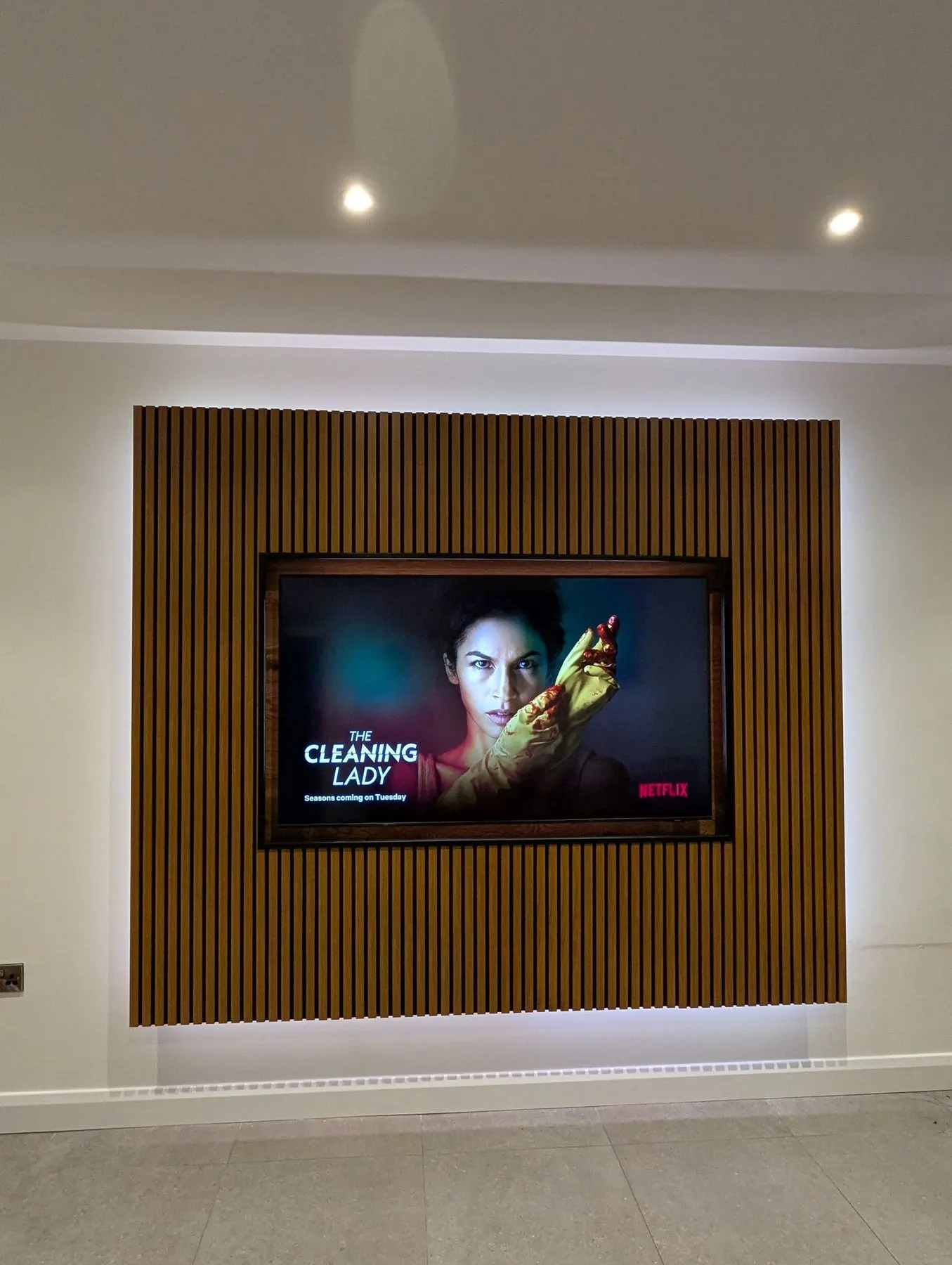 Bespoke media wall LED feature lighting close up after installation.