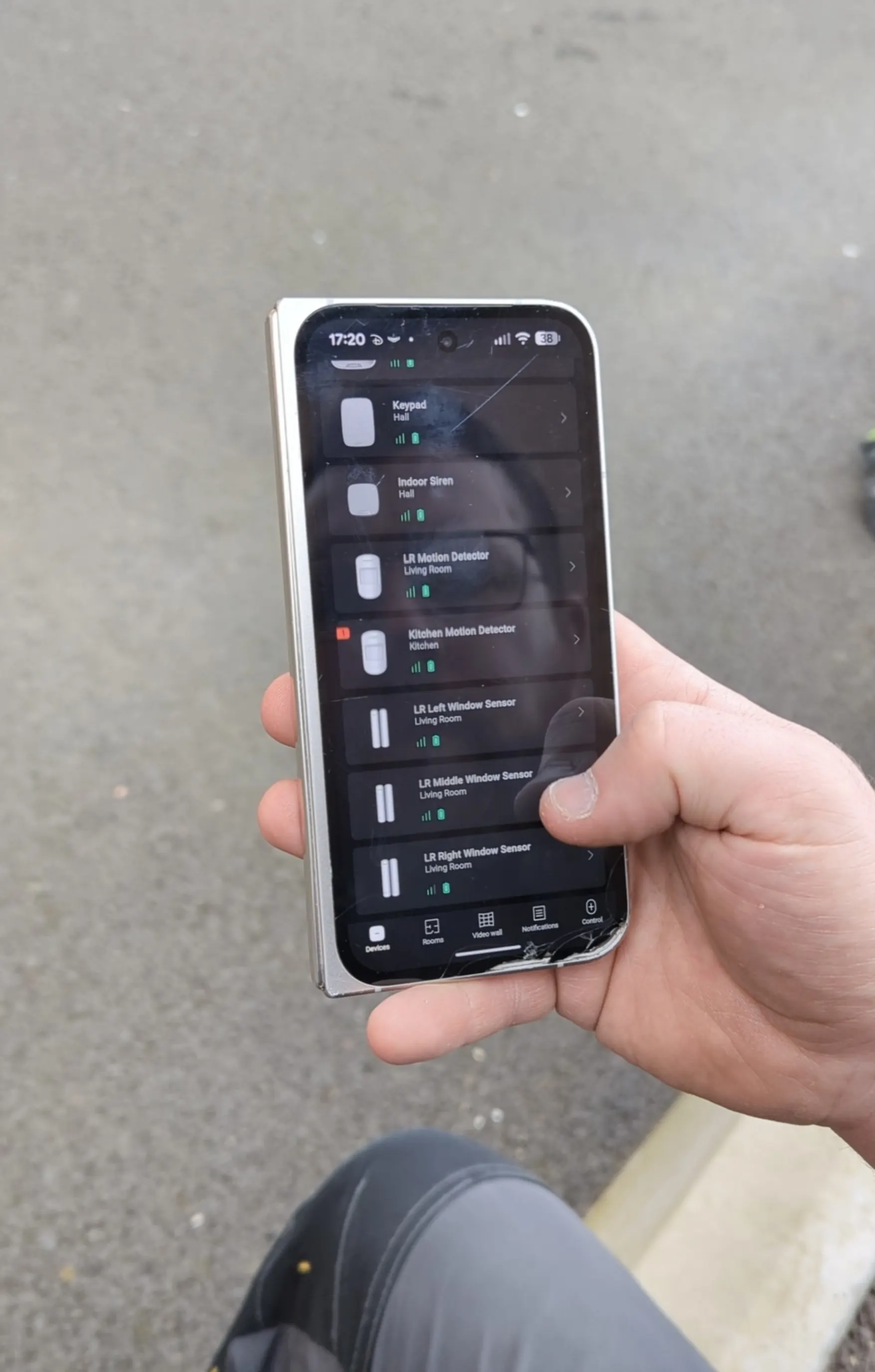 Ajax home alarm mobile app showing connected device status for residential alarm monitoring.